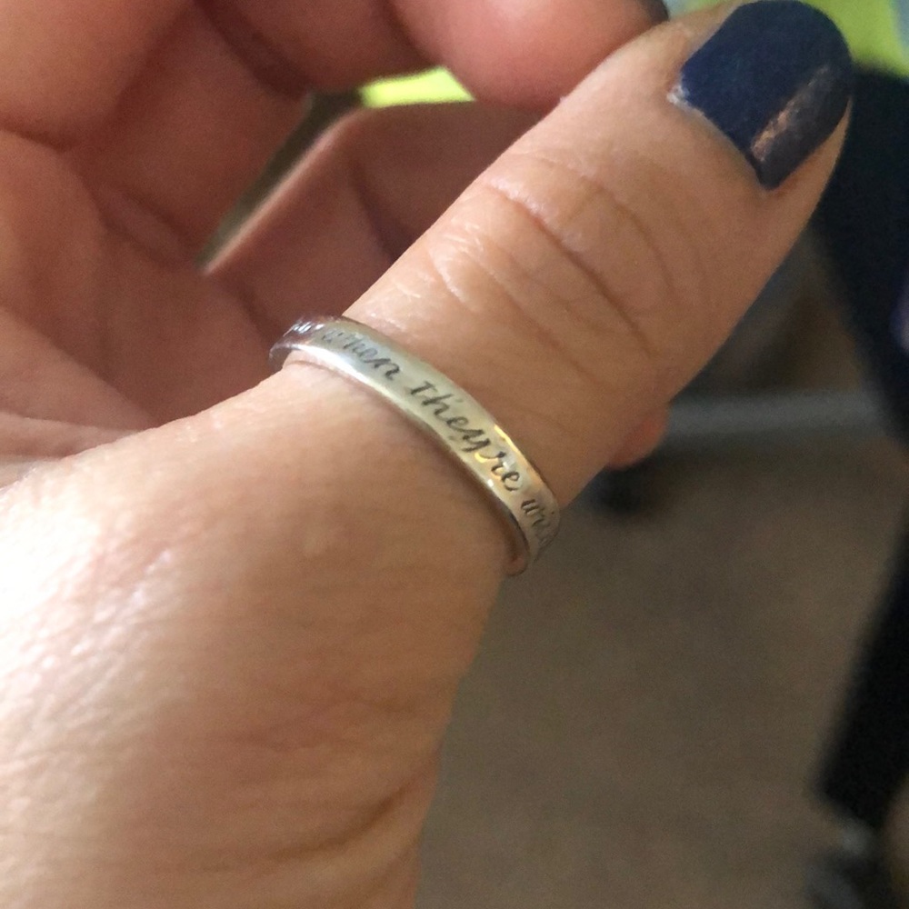Silver ring with “dreams come true...” engraving